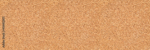 empty corkboard or pinboard or bulletin board cork background in wide banner or header format