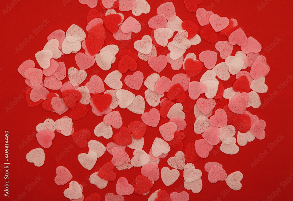 Red pink and white hearts on a red background. Valentine's day concept. Selective focus. Postcard. Background. Red pink and white hearts on a red background. Valentine's day concept. Selective focus. Postcard. Background.