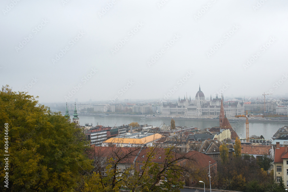 Aerial view of Budapest from Fisherman's bastion in a cloudy day: buildings, river and parliament house