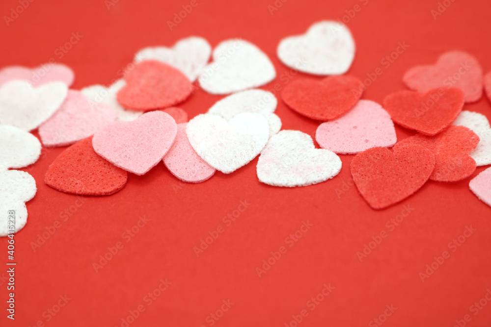 Red pink and white hearts on a red background. Valentine's day concept. Selective focus. Postcard. Background.