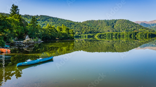 Reflections on the quiet Lac Chambon in Auvergne, France