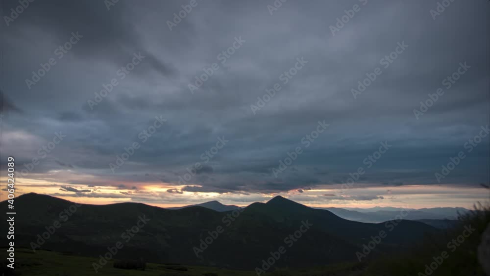 Cloudy sky in the mountains at sunset. High quality 4k footage Cloudy sky in the mountains at sunset. High quality 4k footage