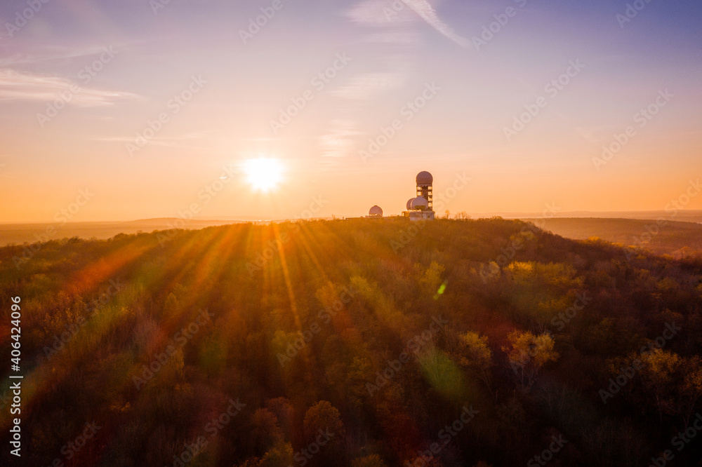 Fototapeta premium sunset above silhouette of former surveillance station in berlin