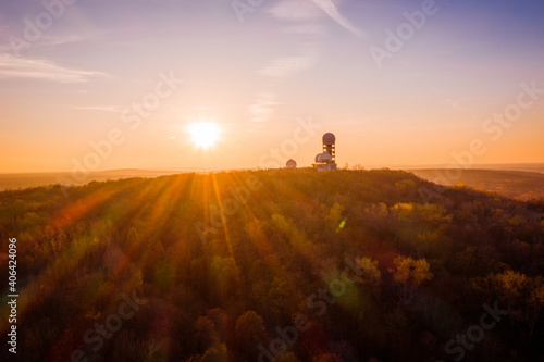 sunset above silhouette of former surveillance station in berlin