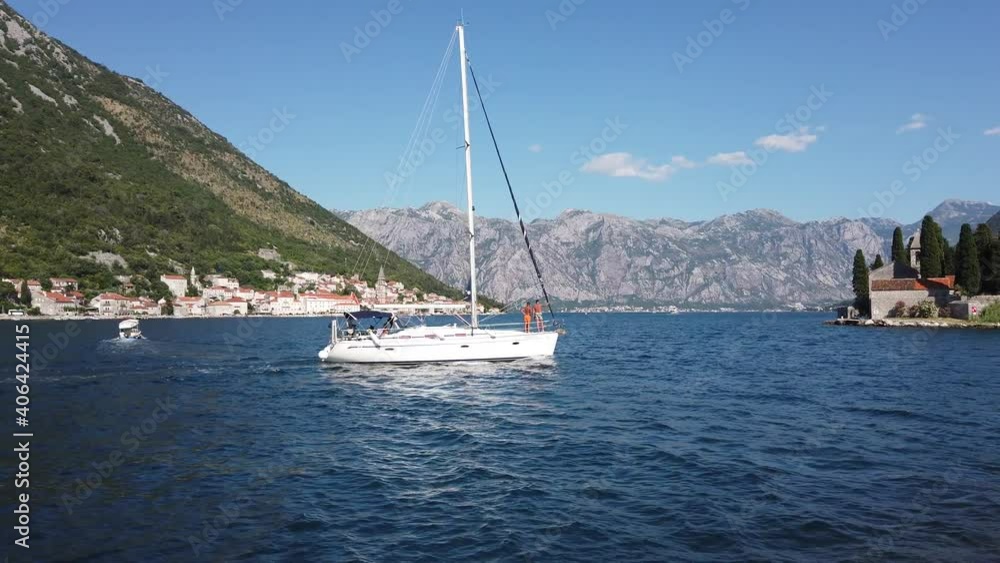 Sailing boat in the bay of Kotor, Montenegro - Steadicam shot from the water Sailing boat in the bay of Kotor, Montenegro - Steadicam shot from the water