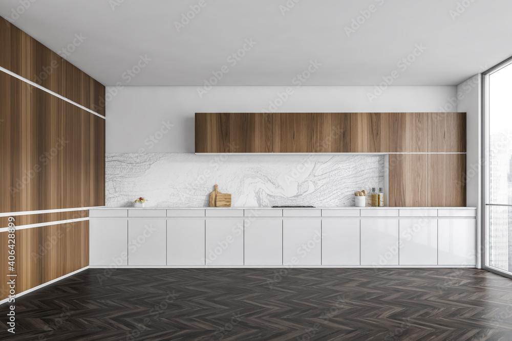 White and wooden empty kitchen with dark parquet floor and window White and wooden empty kitchen with dark parquet floor and window