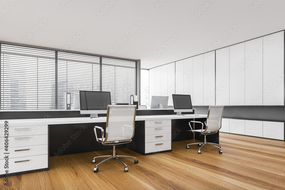 Naklejka premium White office room with tables and computers, armchairs on parquet floor