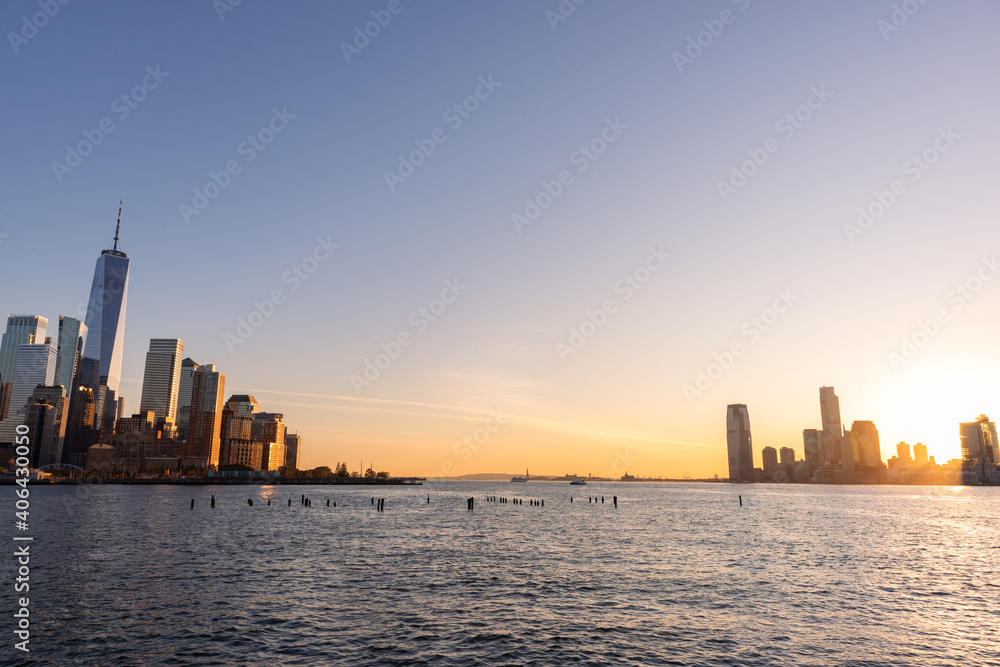 Bright Sunset on the Hudson River between the New York City and Jersey City Skyline