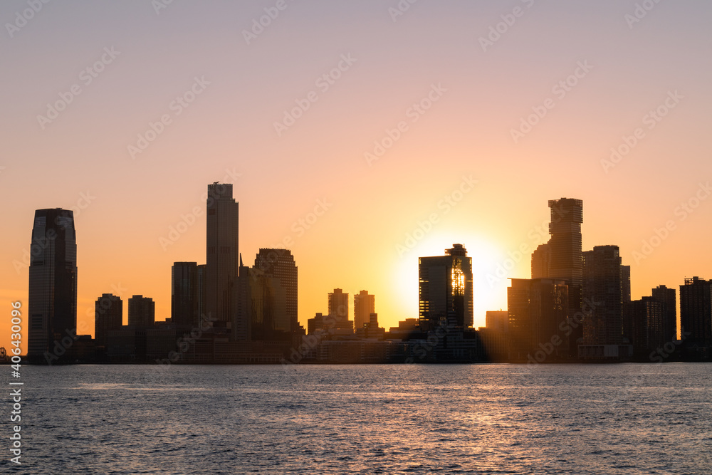 Jersey City New Jersey Skyline Silhouette during a Bright Sunset along the Hudson River