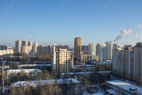 top panoramic view of the city with modern high residential buildings on a frosty winter sunny day against a clear blue sky and space to copy in Reutov Moscow Region Russia