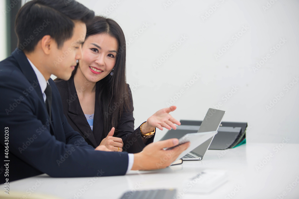 Asia business partner Who agreed to do business together and successfully two people working at the meeting Asia business partner Who agreed to do business together and successfully two people working at the meeting