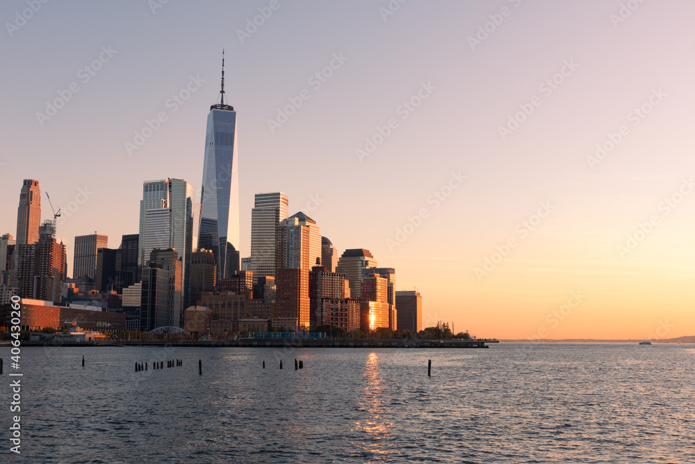 Fototapeta premium Beautiful Lower Manhattan New York City Skyline along the Hudson River during a Colorful Sunset