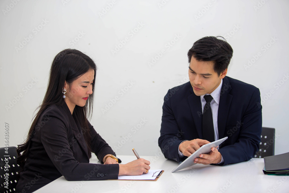 Asia business partner Who agreed to do business together and successfully two people working at the meeting Asia business partner Who agreed to do business together and successfully two people working at the meeting