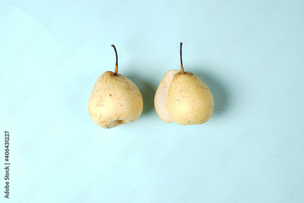 Fresh pear set, isolated whole and sliced. From the top view as a package design element. The pear placement concept is combined with a plain background, commonly used for design templates and mockups Fresh pear set, isolated whole and sliced. From the top view as a package design element. The pear placement concept is combined with a plain background, commonly used for design templates and mockups