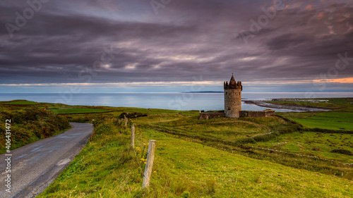 Photography Doonagore Castle is a round 16th-century tower house with a small walled enclosure located about 1 km south of the coastal village of Doolin in County Clare, Ireland