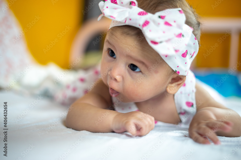 3 Month Old Baby Girl Practicing Development by hold her neck up 45 Degrees 3 Month Old Baby Girl Practicing Development by hold her neck up 45 Degrees
