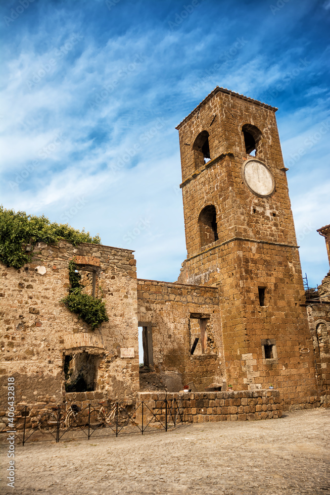Square and tower with the clock in the ghost town of Celleno (Italy)