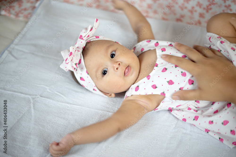 4 Month Old Baby Girl Laying On her Back Looking Up with multiple expressions 4 Month Old Baby Girl Laying On her Back Looking Up with multiple expressions