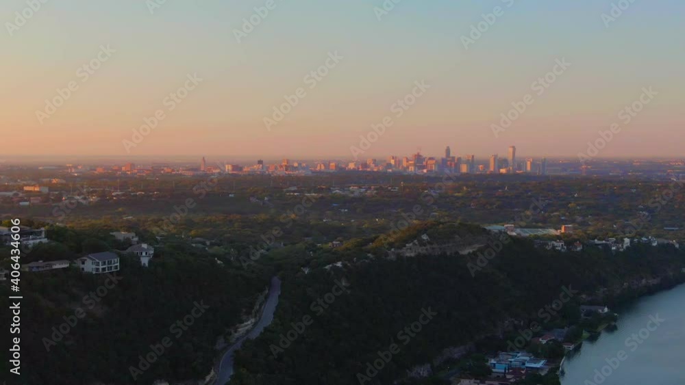 Sweeping sunrise aerial of downtown Austin behind the popular Mt. Bonnell Sweeping sunrise aerial of downtown Austin behind the popular Mt. Bonnell