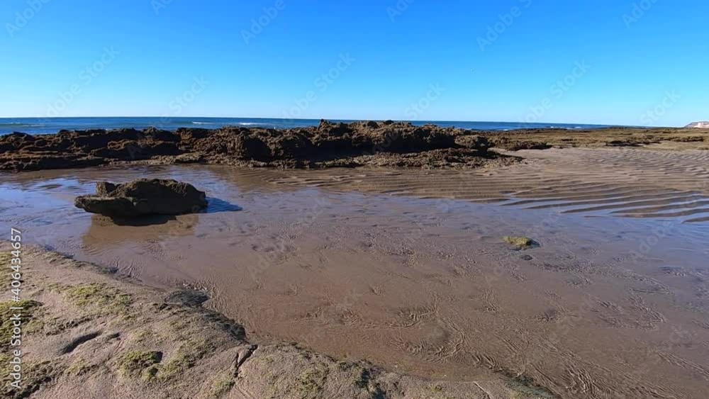 Pan right from the tide going out to the now revealed beach and sea bottom, Puerto Peñasco, Gulf of California, Mexico. Pan right from the tide going out to the now revealed beach and sea bottom, Puerto Peñasco, Gulf of California, Mexico.