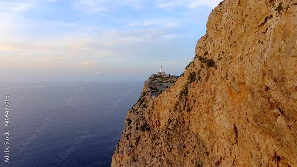 Drone shot of a lighthouse in Mallorca. Sunny evening. Drone shot of a lighthouse in Mallorca. Sunny evening.