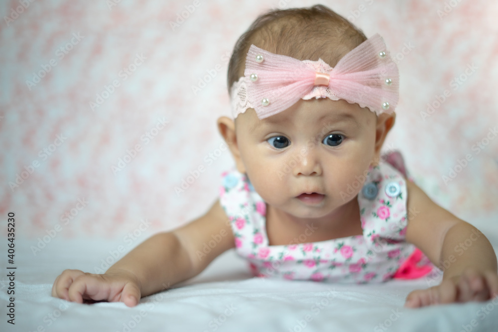 3 Month Old Asian Baby Girl Holding her head up at 45 degrees Child Development 3 month old baby girl 3 Month Old Asian Baby Girl Holding her head up at 45 degrees Child Development 3 month old baby girl