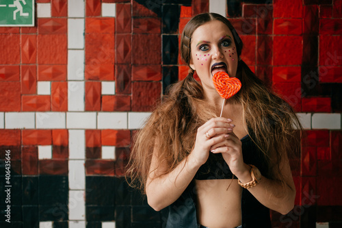 Photos Young agressive clown girl with sweet