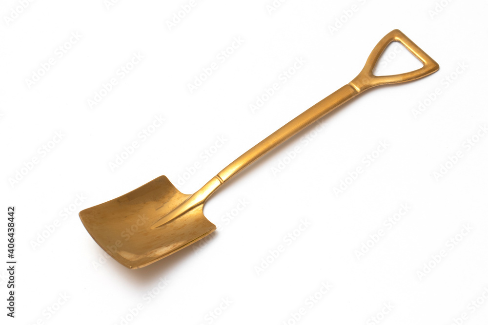 Top view of golden spoon shovel isolated white background.