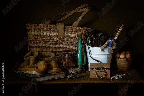 #37 Woven abaca bag, a white bucket,  a pair of baby shoes, and some bric-a-brac photo