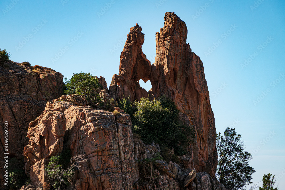Heart shaped hole in a rock formation in the bizzare landscape of Calanche de Piana, located in n the Gulf of Porto, on the west coast of Corsica, France