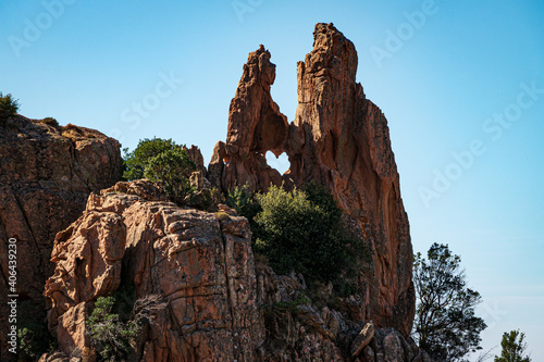 Heart shaped hole in a rock formation in the bizzare landscape of Calanche de Piana, located in n the Gulf of Porto, on the west coast of Corsica, France photo