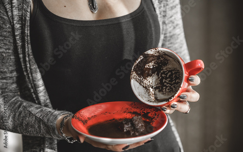 Mystical scene with Fortune teller divines on coffee grounds, concept of predictions photo