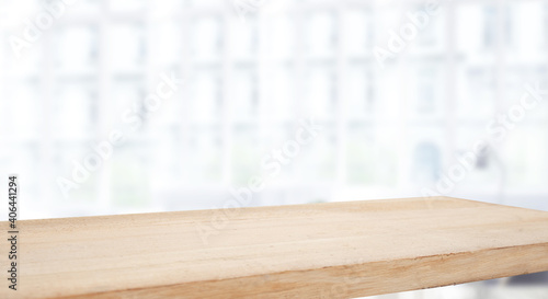 empty wooden table on background of abstract blur white interior  montage  product display  inside and window..