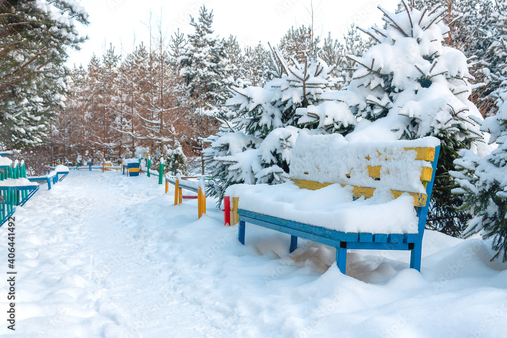 custom made wallpaper toronto digitalBench covered with a thick layer of snow in the park near the path