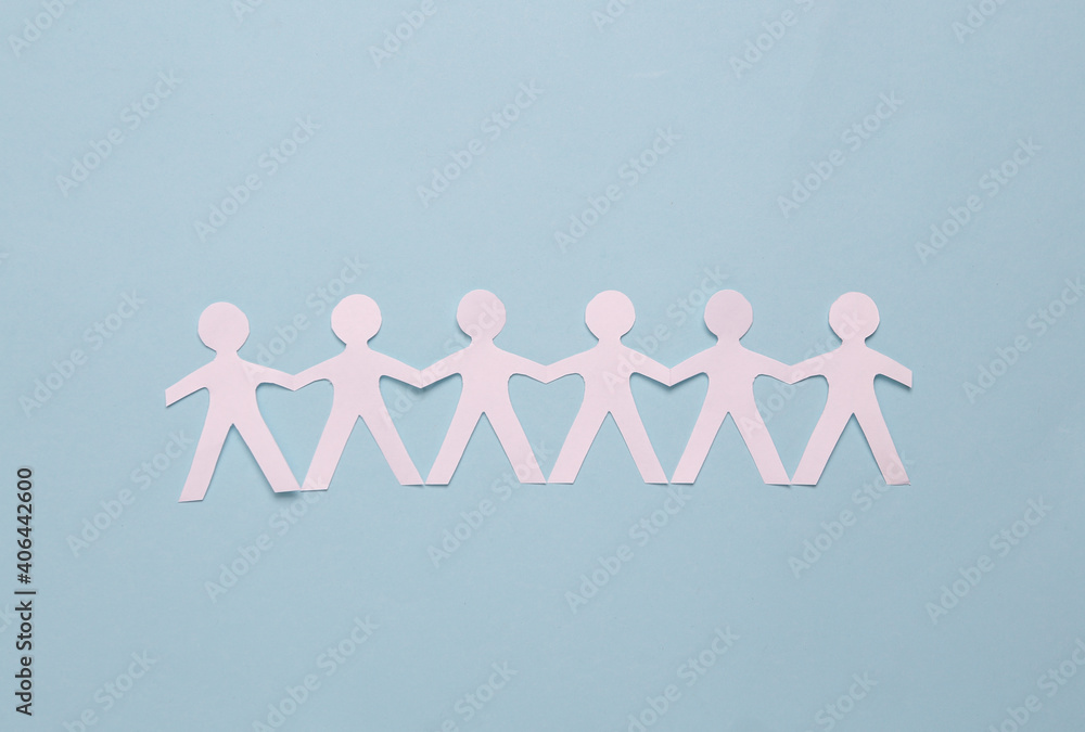 Cut paper human chain hold hands and show their unity on blue background. Solidarity and peace Cut paper human chain hold hands and show their unity on blue background. Solidarity and peace
