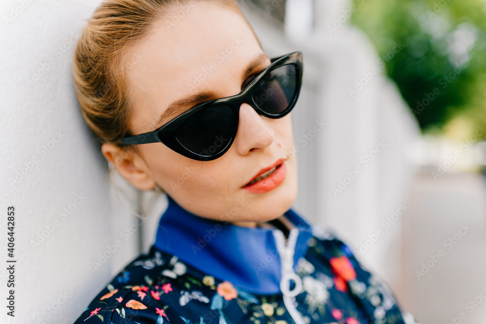 Portrait of beautiful young blond model with sunglasses Portrait of beautiful young blond model with sunglasses