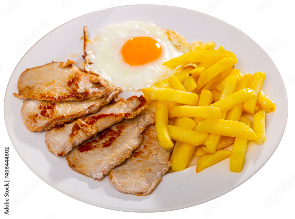 Sliced grilled pork steak served with french fries and scrambled eggs