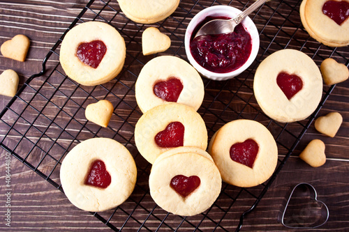 Heart shaped traditional linzer cookies with strawberry jam. Valentine s day concept.
