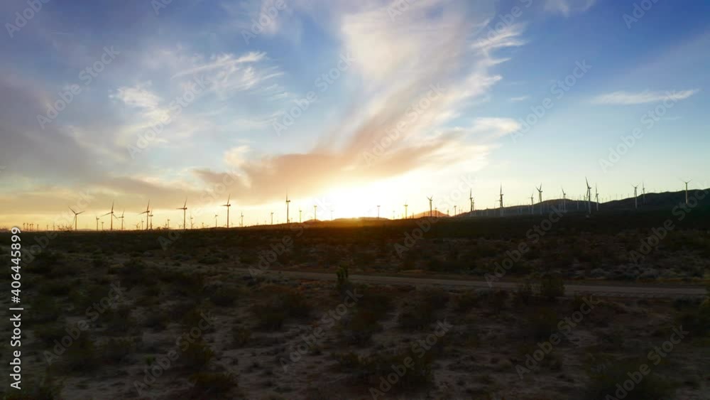 Aerial view of power generating wind turbines at sunset in the Mojave Desert - push in Aerial view of power generating wind turbines at sunset in the Mojave Desert - push in