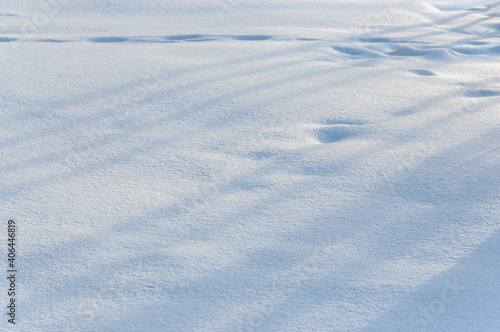 snow cover background with soft longitudinal shadows