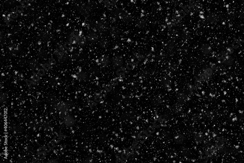 High-quality simulation of a Snowstorm. Flying Snowflakes. Blank to add to photos. Winter Background. Snowfall, Storm, Blizzard. Isolate on a black background.