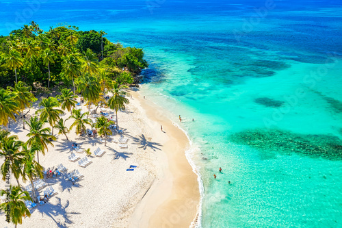Aerial drone view of the beautiful small island and palm trees of Atlantic Ocean. Cayo Levantado island, Samana, Dominican Republic