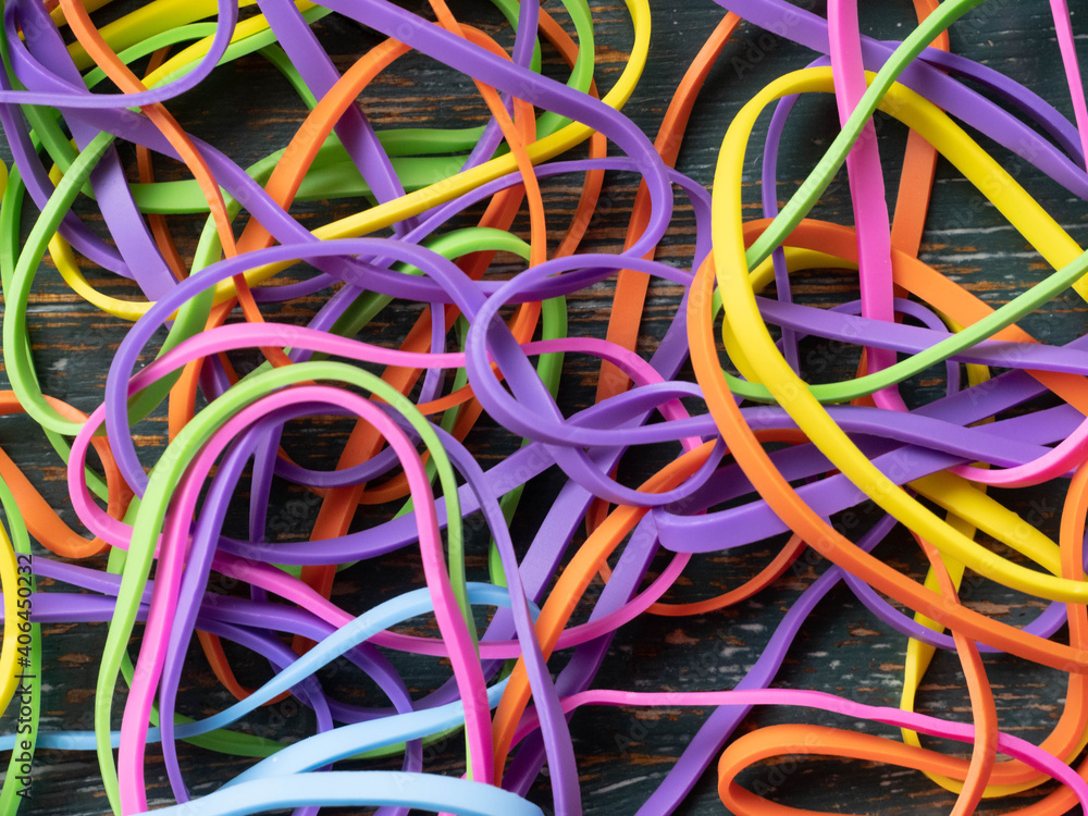 A tangled mess of colourful elastic bands A tangled mess of colourful elastic bands