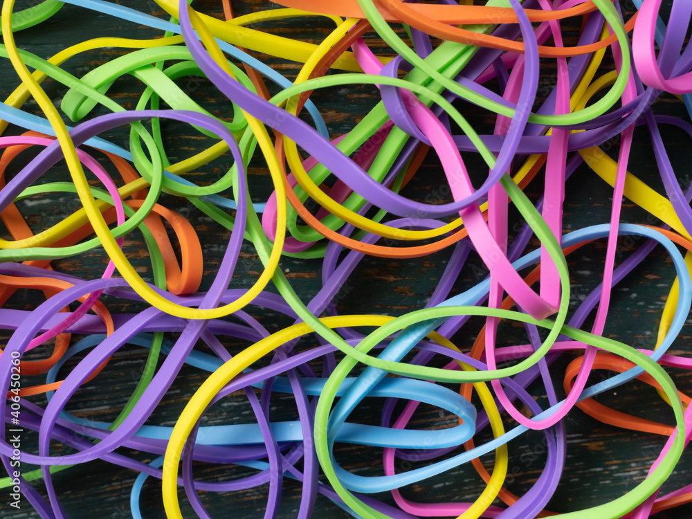 A tangled mess of colourful elastic bands A tangled mess of colourful elastic bands