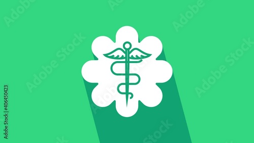 White Emergency star - medical symbol Caduceus snake with stick icon isolated on green background. Star of Life. 4K Video motion graphic animation. photo