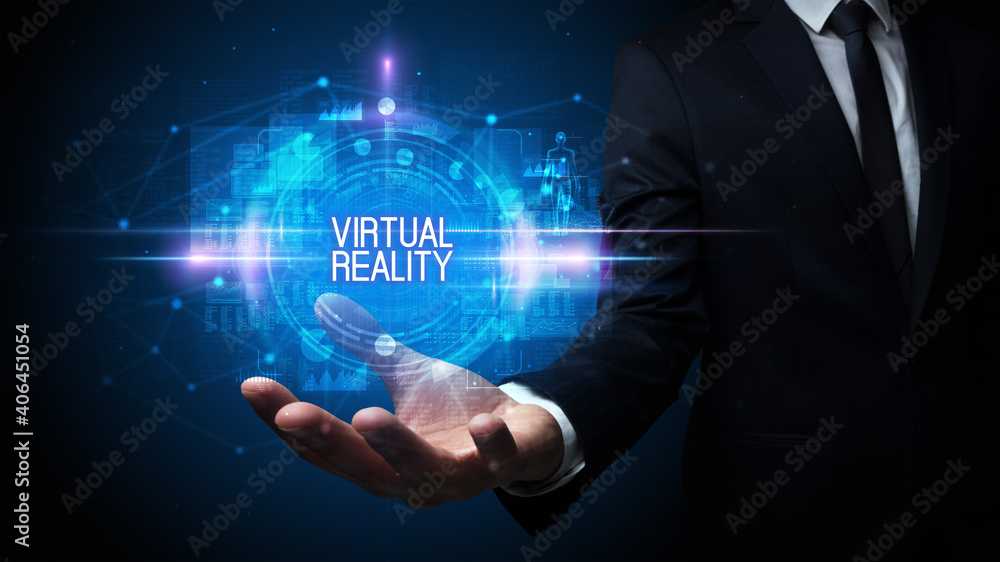 Man hand holding VIRTUAL REALITY inscription, technology concept Man hand holding VIRTUAL REALITY inscription, technology concept