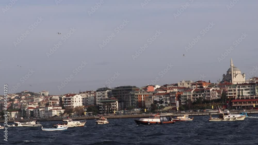 Boats Floating In The Waters Of Bosphorus In Istanbul With View Of Uskudar City In The Background, POV, wide shot Boats Floating In The Waters Of Bosphorus In Istanbul With View Of Uskudar City In The Background, POV, wide shot