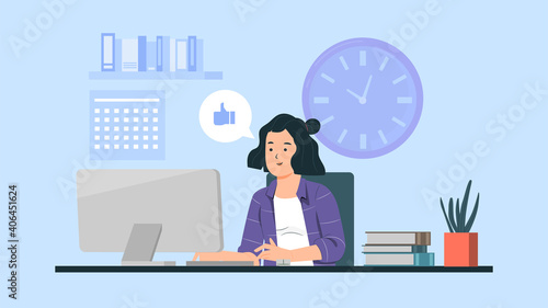 Business woman working on computer at her office desk.