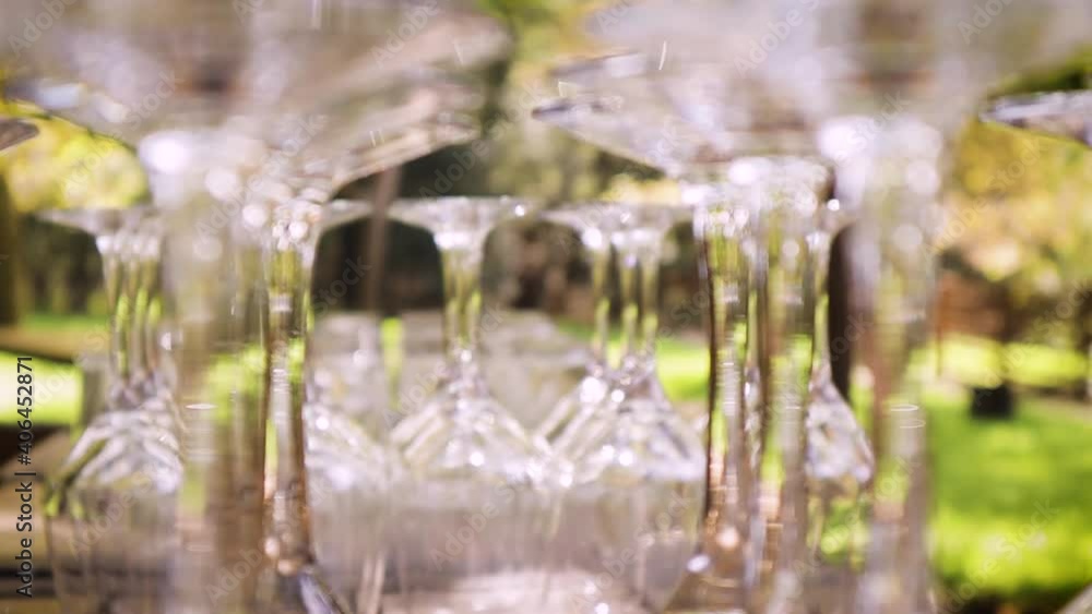 Glasses are stacked at a wedding reception. Glasses are stacked at a wedding reception.