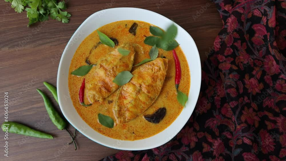 Kerala fish curry coconut milk gravy , cooking spicy Goan fish curry , Indian fish curry Bengali fish curry in coconut milk 4K slow motion video footage Kolkata, India Sri Lanka. Lankan food. Kerala fish curry coconut milk gravy , cooking spicy Goan fish curry , Indian fish curry Bengali fish curry in coconut milk 4K slow motion video footage Kolkata, India Sri Lanka. Lankan food.
